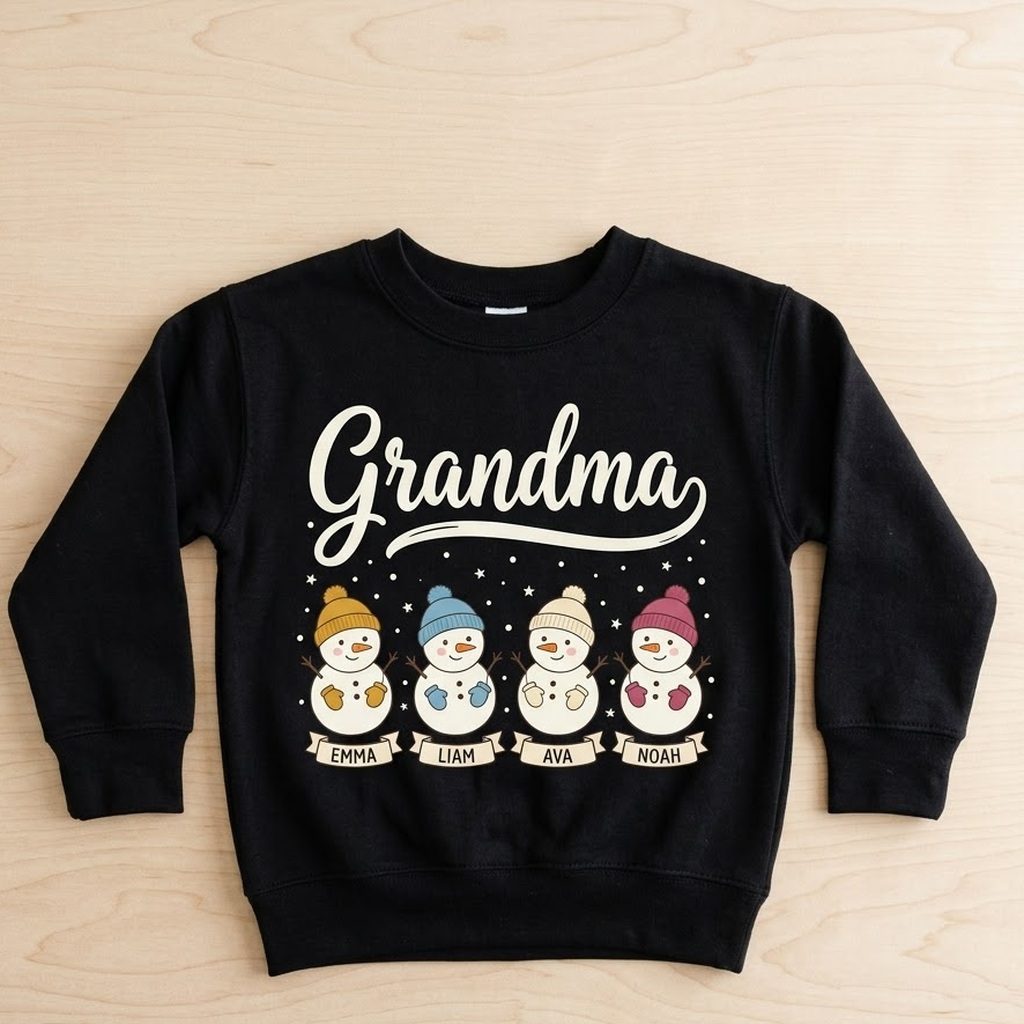 Snowman grandma sweatshirt with names in black laid flat on light wood