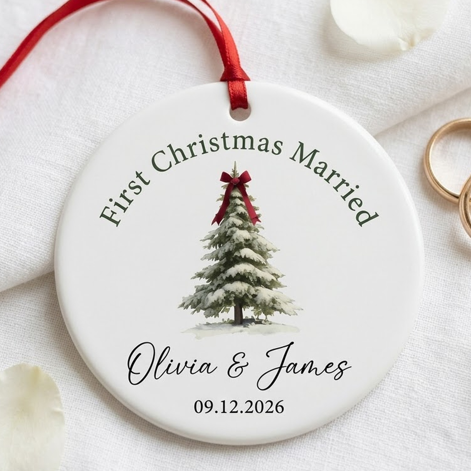 First christmas married ornament in white ceramic with snowy pine tree