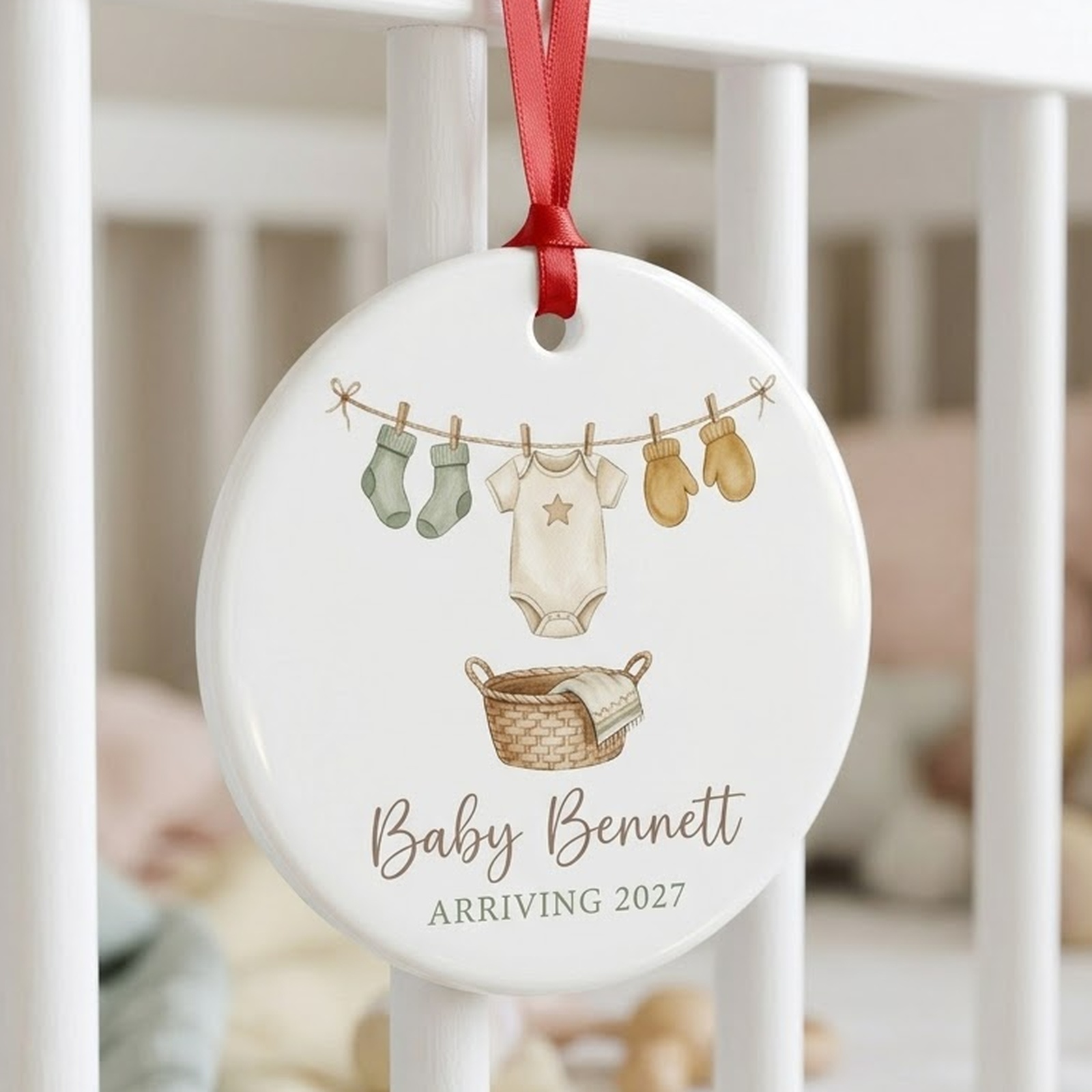 Expecting baby ornament in white ceramic with baby clothesline